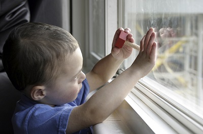 Child looking out window.